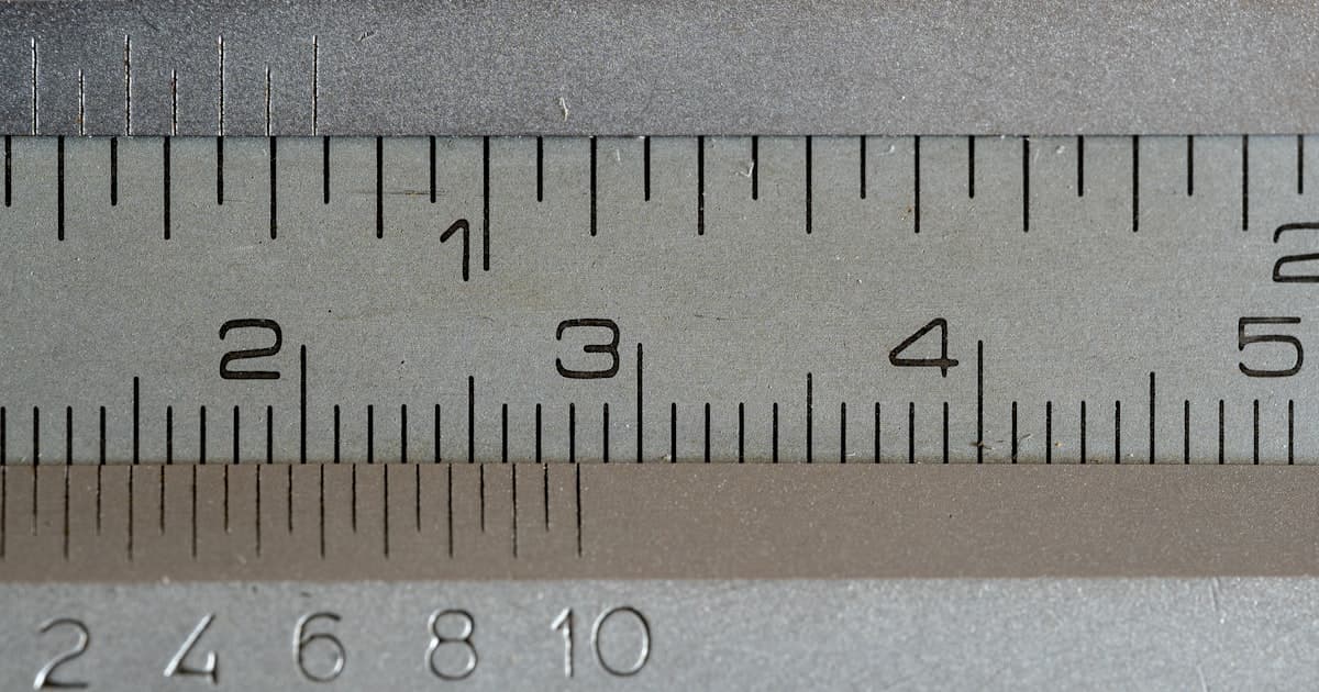 Close-up of a metal vernier caliper's measurement scales
