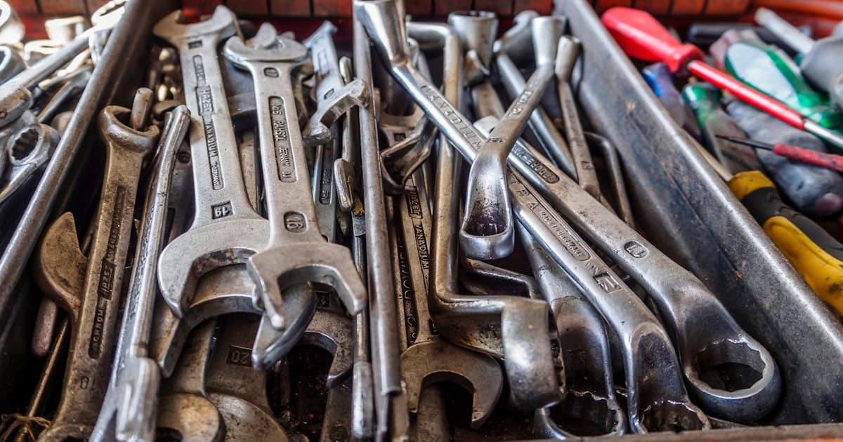 A toolbox filled with wrenches and other tools